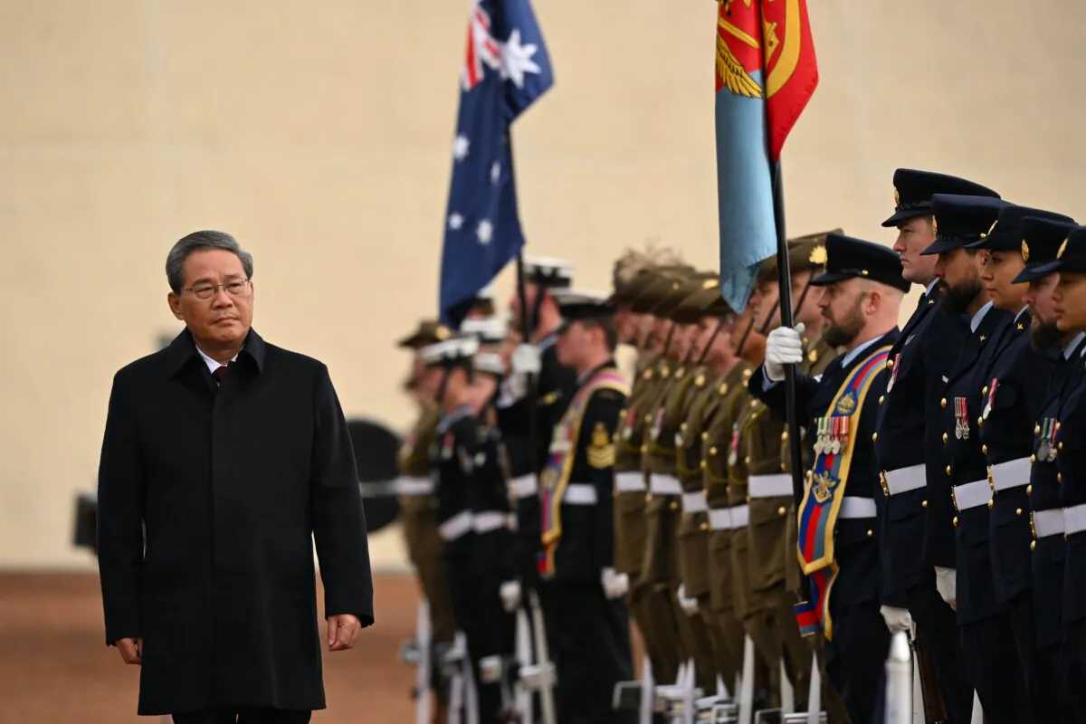 CCP Premier Li Qiang inspects a guard of honour outside the Australian Parliament House in Canberra, Australia on June 17, 2024. Li Qiang, who is second only to CCP leader Xi Jinping, is on a four-day visit to Australia. (AAP Image/Lukas Coch) 