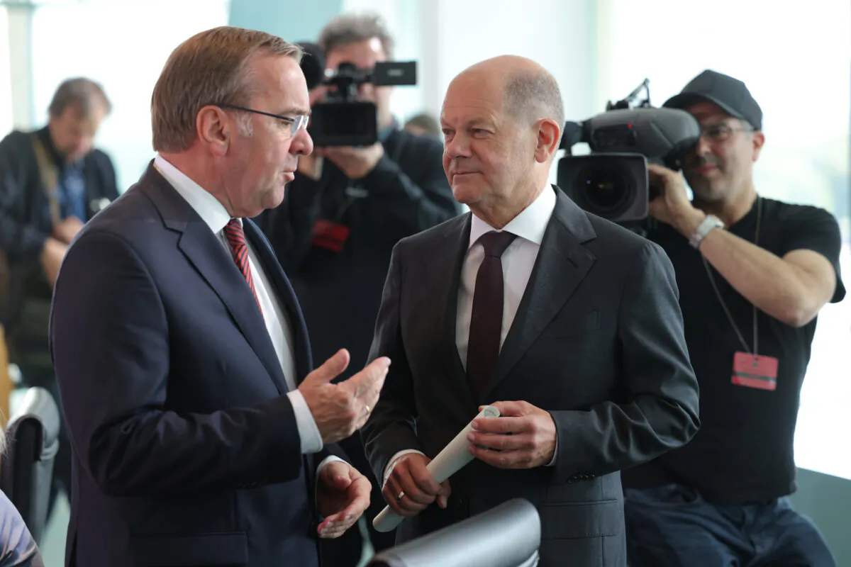 German Chancellor Olaf Scholz (C) chats with Defence Minister Boris Pistorius (L) at the weekly federal government cabinet meeting in Berlin, Germany, on June 12, 2024. (Sean Gallup/Getty Images)