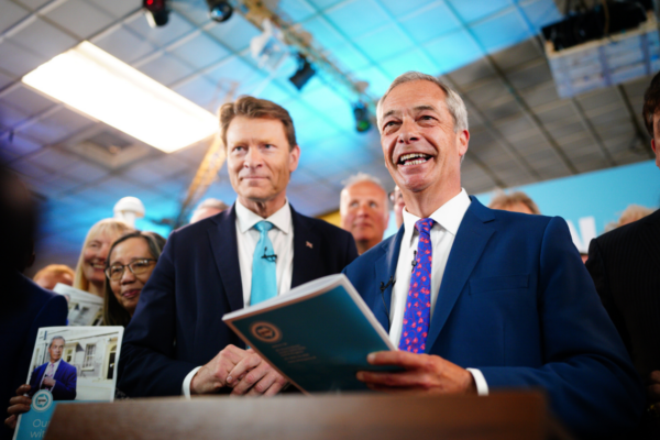 Reform UK chairman Richard Tice (left) and party leader Nigel Farage launch 'Our Contract with You' while on the General Election campaign trail in Merthyr Tydfil, Wales, on June 17, 2024. (Ben Birchall/PA Wire)