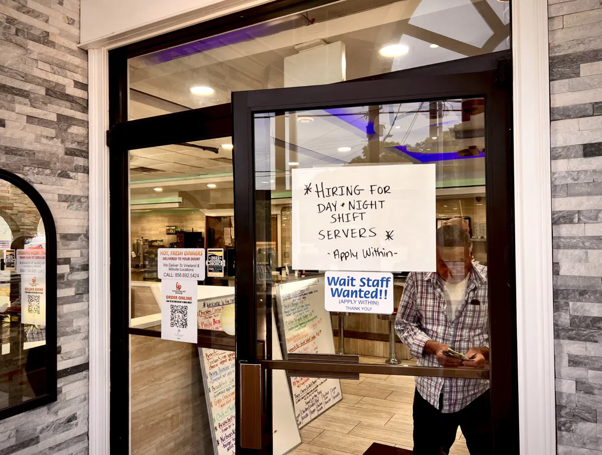 Hiring announcement on a door at a restaurant in Vineland, N.J., on June 4, 2024. (Madalina Vasiliu/The Epoch Times)