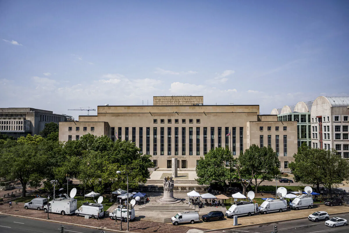 Media tents and television satellite trucks are set up outside the E. Barrett Prettyman U.S. Courthouse in Washington on July 27, 2023. (Drew Angerer/Getty Images)