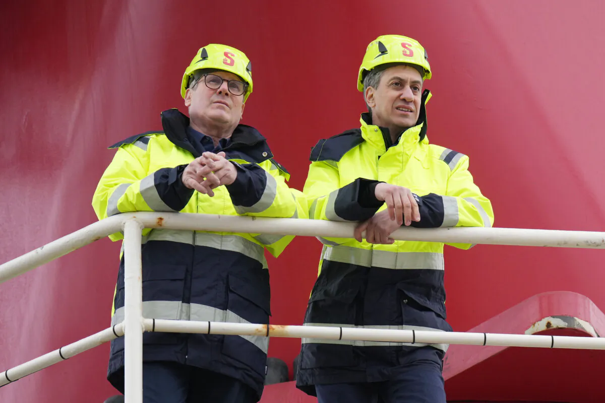 Labour leader Sir Keir Starmer (L) and shadow energy secretary Ed Miliband view and tour Excalibur, an offshore jack up platform for wind turbine construction and maintenance in Holyhead, Wales, on March 25, 2024. (Christopher Furlong/Getty Images)