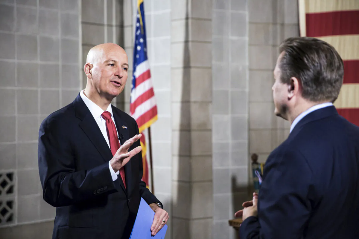 Nebraska Gov. Pete Ricketts (L) and Jan Jekielek, host of The Epoch Times's "American Thought Leaders," in the state's capitol in Lincoln on June 24, 2021. (Petr Svab/The Epoch Times)