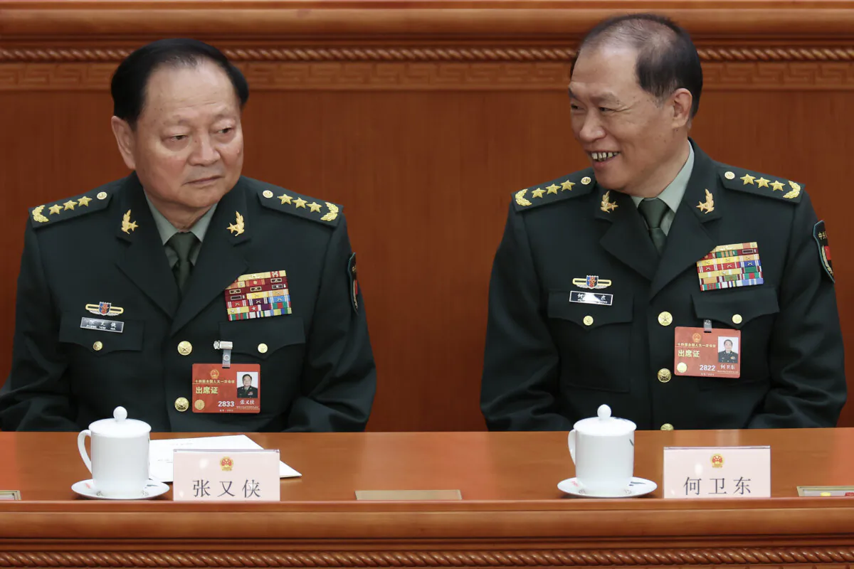 Vice chairman of the Central Military Commission of the People's Republic of China Zhang Youxia (L) and He Weidong attend the fifth plenary session of the National People's Congress in Beijing on March 12, 2023. (Lintao Zhang/Getty Images)