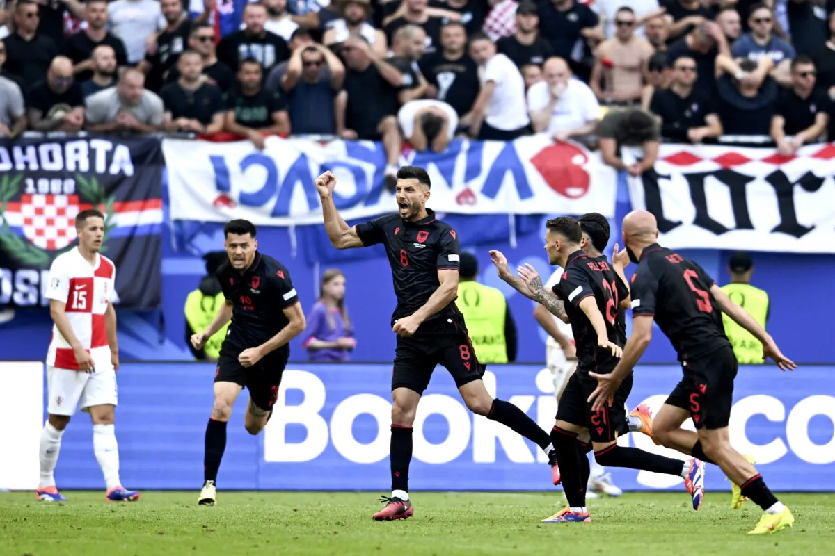 Albania's scorer Klaus Gjasula (3rd L) and his teammates celebrate their side's second goal during a Group B match between Croatia and Albania at the Euro 2024 soccer tournament in Hamburg, Germany, on June 19, 2024. (Sina Schuldt/dpa via AP)
