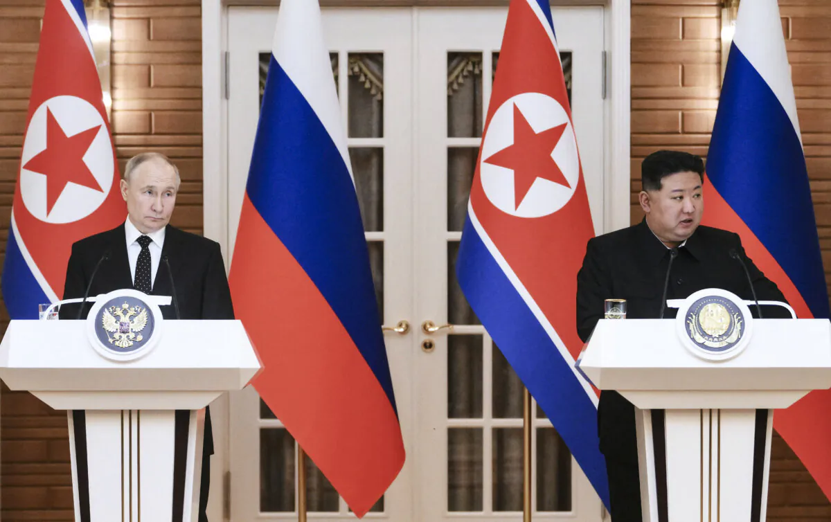 Russian President Vladimir Putin (L) and North Korea's leader Kim Jong Un (R) talk to the media following their bilaterial talks at Kumsusan state residence in Pyongyang, North Korea, on June 19, 2024. (Kristina Kormilitsyna/AFP via Getty Images)