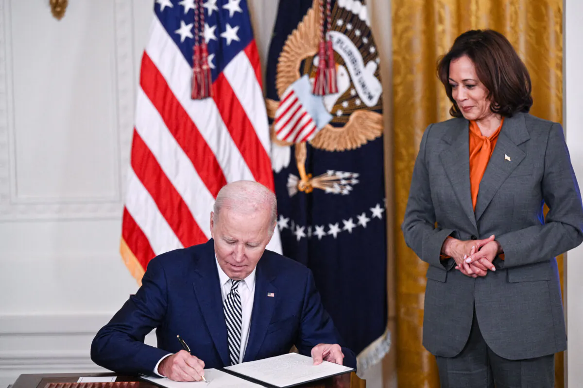 President Joe Biden signs an executive order in the East Room of the White House on Oct. 30, 2023. 

BRENDAN SMIALOWSKI/AFP via Getty Images