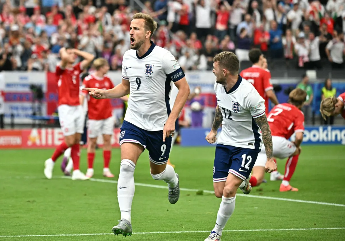 England's forward #09 Harry Kane celebrates scoring his team's first goal next to England's defender #12 Kieran Trippier (R) during the UEFA Euro 2024 Group C football match between Denmark and England in Frankfurt on June 20, 2024.  (Javier Soriano/AFP via Getty Images)