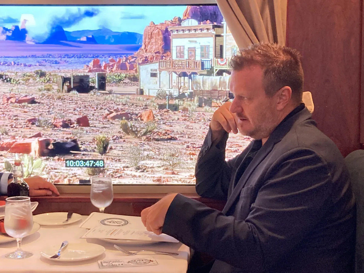 Royal Caribbean's chief product innovation officer, Jay Schneider, sits on a test version of the Royal Railway—Utopia Station dining venue at the company's Miami headquarters on May 23, 2024. (Richard Tribou/Orlando Sentinel/TNS)