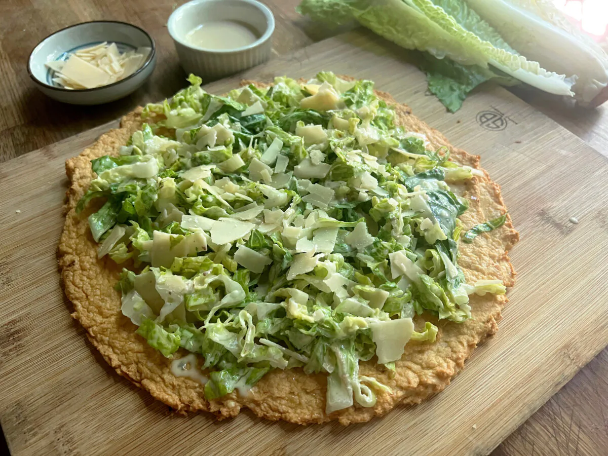 Canned chicken mixed with egg and grated Parmesan serves as the base for this caesar salad pizza that's gone viral on TikTok. (Gretchen McKay/Pittsburgh Post-Gazette/TNS)