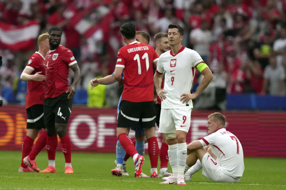 Poland's Robert Lewandowski (9) reacts after during a Group D match between Poland and Austria at the Euro 2024 soccer tournament in Berlin, Germany on June 21, 2024. (Sunday Alamba/AP Photo)