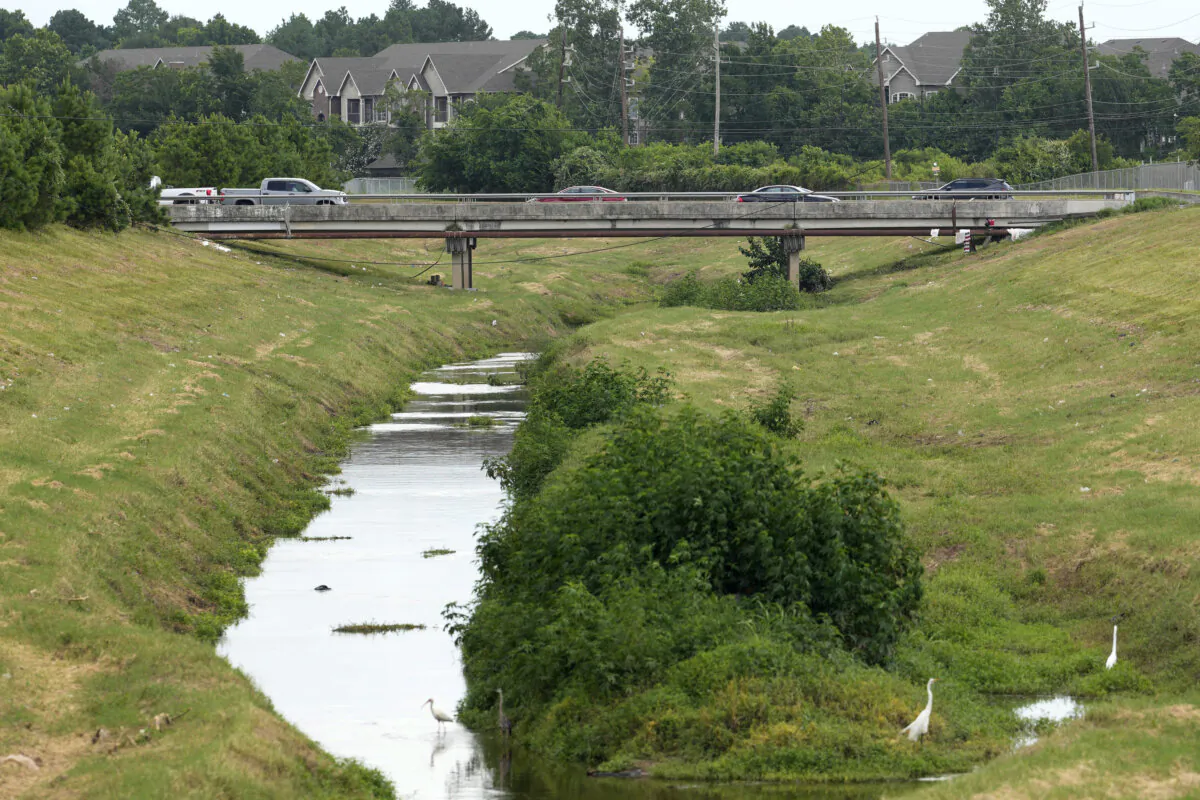 A bridge crosses a creek in Houston on June 18, 2024. (Melissa Phillip/Houston Chronicle via AP)