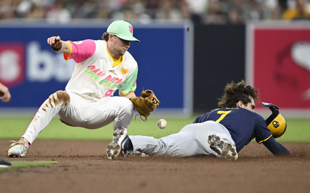 Tyler Black (7) of the Milwaukee Brewers steals second base as Jake Cronenworth (9) of the San Diego Padres loses the ball during the fifth inning of a baseball game in San Diego on June 21, 2024. (Denis Poroy/Getty Images)