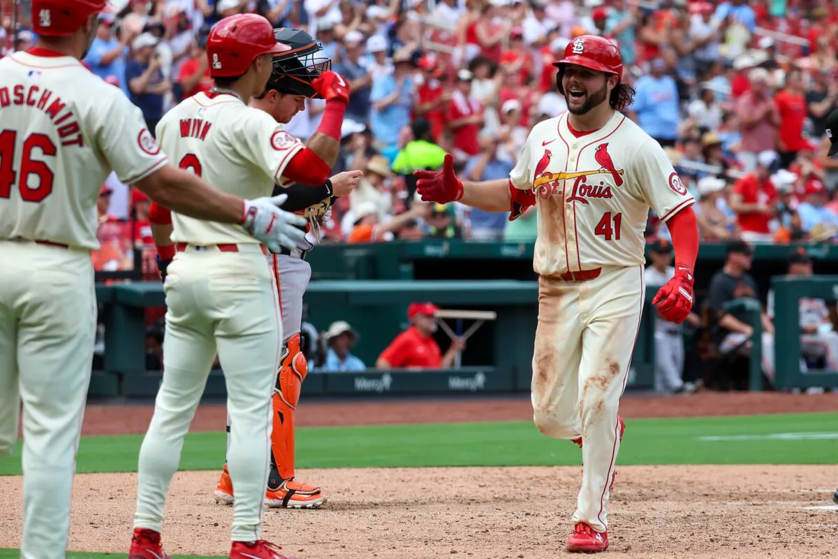 Alec Burleson (41) of the St. Louis Cardinals celebrates with teammates after hitting a two-run home run during the sixth inning against the San Francisco Giants in St. Louis on June 22, 2024. (Scott Kane/Getty Images)