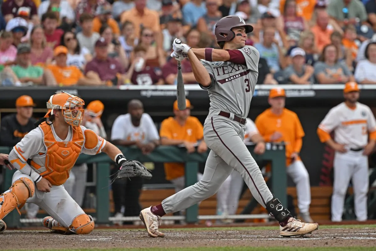 Kaeden Kent (3) of the Texas A&M Aggies drives in two run with a single in the third inning against the Tennessee Volunteers during the NCAA Division I Baseball Championship in Omaha, Neb., on June 22, 2024. (Peter Aiken/Getty Images)