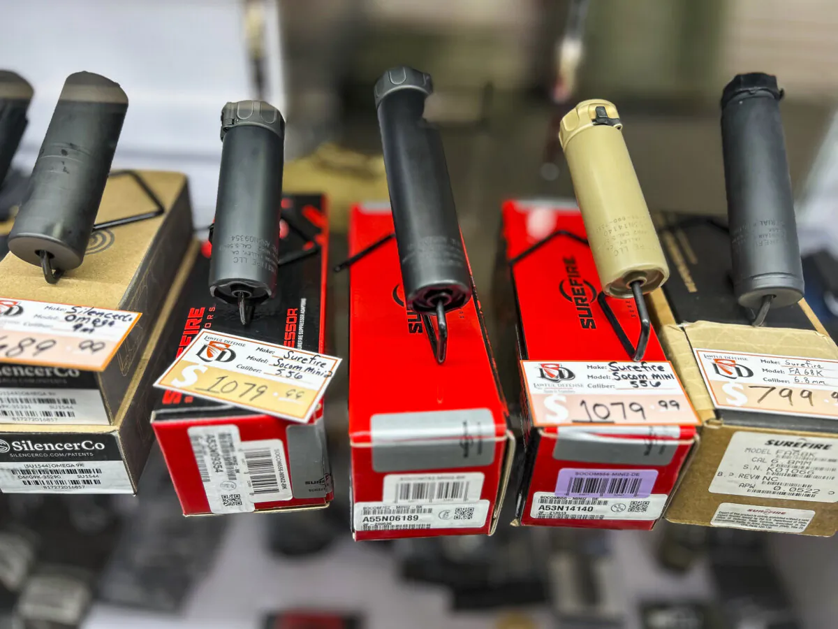 An assortment of silencers are displayed in a case at Lawful Defense in Gainesville, Fla., on April 19, 2023. (Nanette Holt/The Epoch Times)