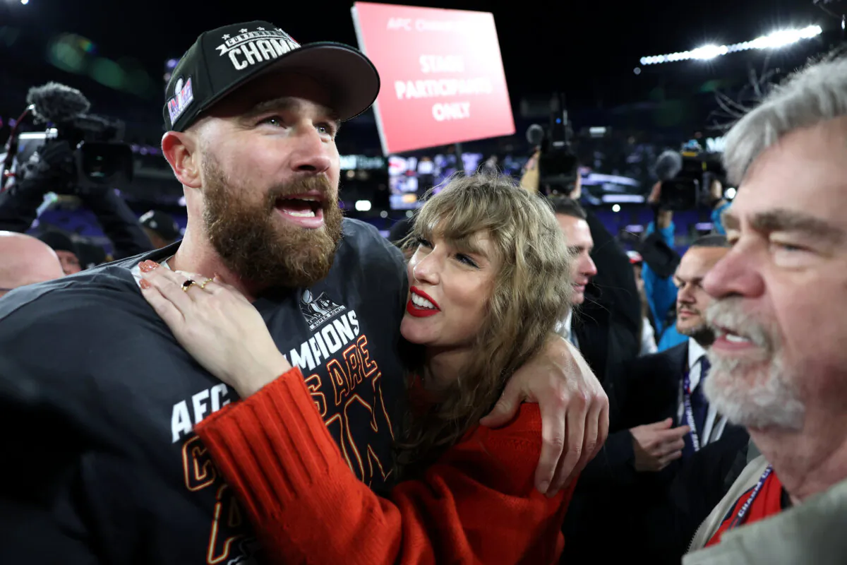 Travis Kelce #87 of the Kansas City Chiefs celebrates with Taylor Swift after a 17–10 victory against the Baltimore Ravens in the AFC Championship Game at M&T Bank Stadium in Baltimore on Jan. 28, 2024. (Patrick Smith/Getty Images)