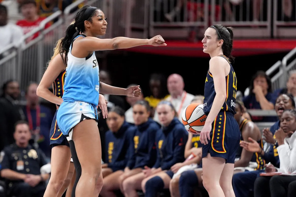 Angel Reese (5) of the Chicago Sky reacts after fouling Caitlin Clark (22) of the Indiana Fever during the second half in Indianapolis on June 16, 2024. (Emilee Chinn/Getty Images)