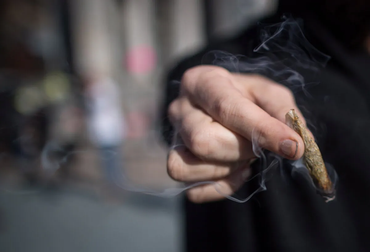 A man holds a marijuana joint in Vancouver, in this file photo. (The Canadian Press/Darryl Dyck)