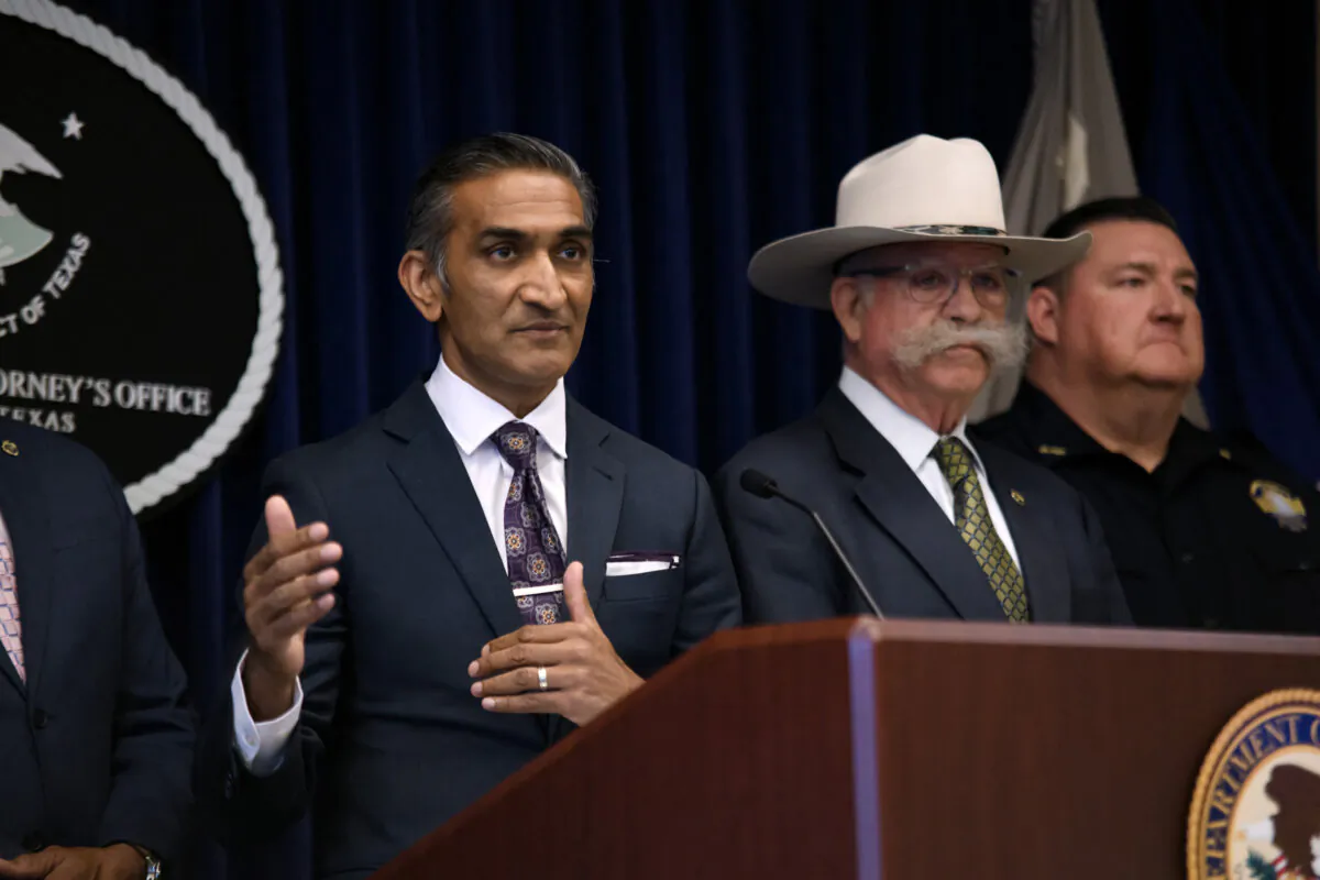 U.S. Attorney for the Southern District of Texas Alamdar S. Hamdani (L) speaks during a news conference in Houston on April 1, 2024. (Mark Felix/AFP via Getty Images)