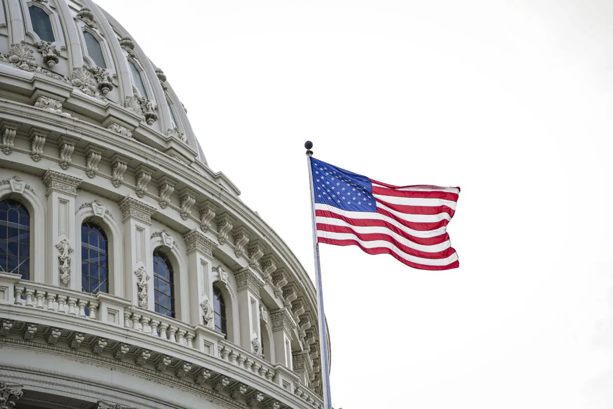 The U.S. flag at the dome of the U.S. Capitol building on May 12, 2023. (Madalina Vasiliu/The Epoch Times)