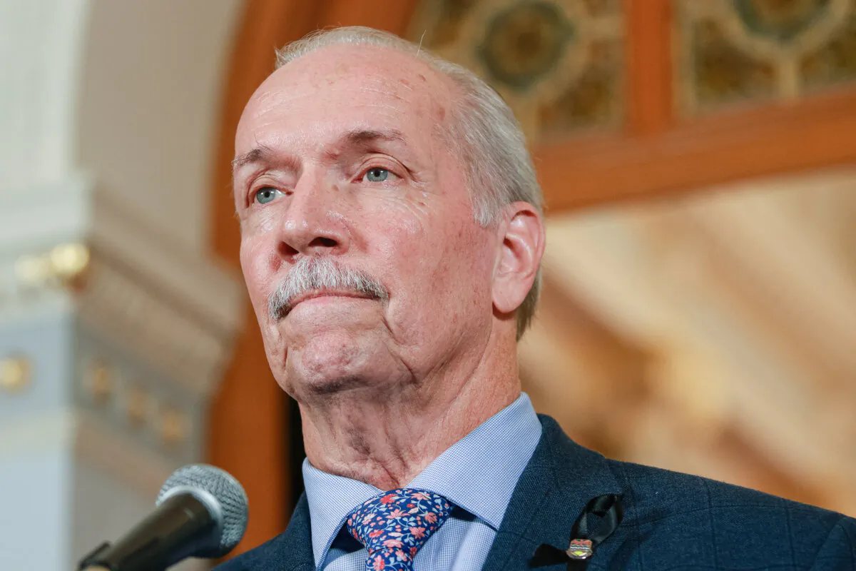 British Columbia Premier John Horgan reacts to questions during a press conference at the legislature in Victoria on Oct. 20, 2022. (The Canadian Press/Chad Hipolito)