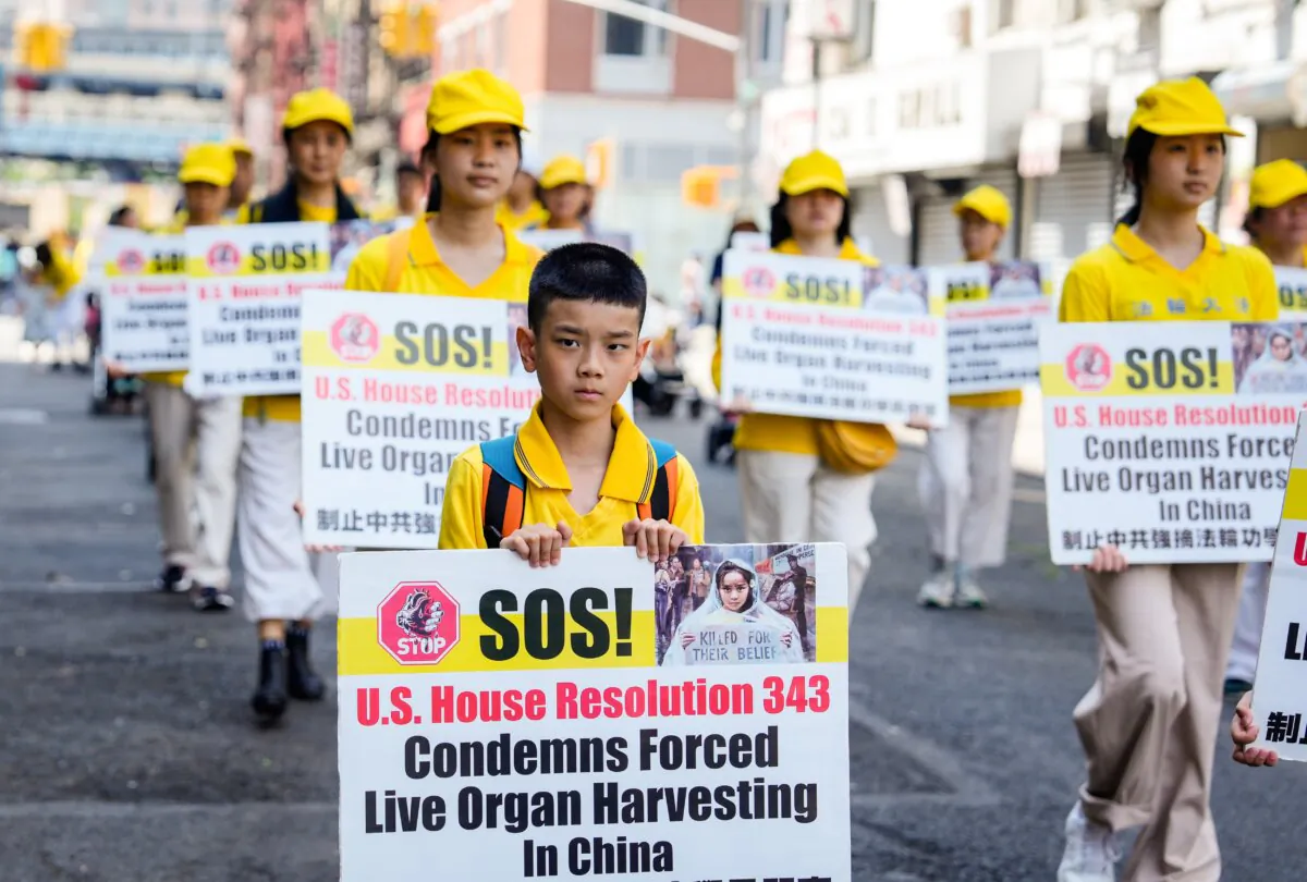 Falun Gong practitioners take part in a parade to commemorate the 24th anniversary of the persecution of the spiritual discipline in China, in New York's Chinatown on July 15, 2023.(Samira Bouaou/The Epoch Times)