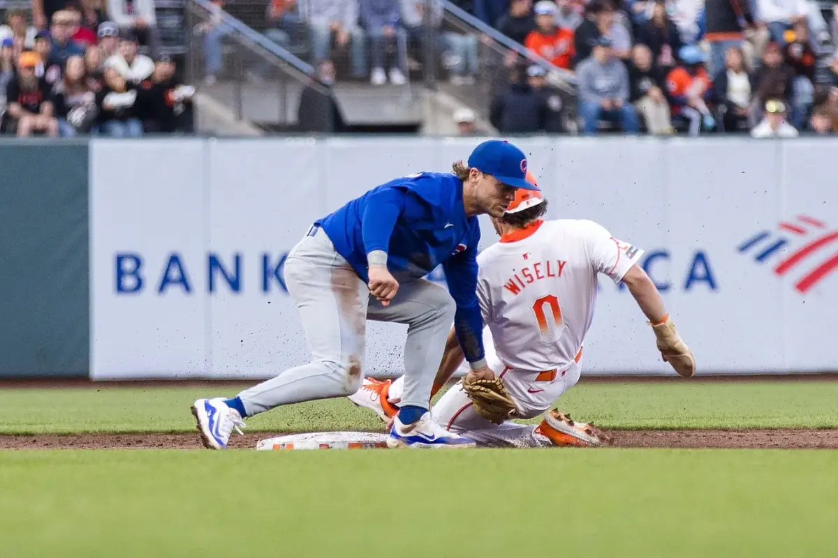 Chicago Cubs second baseman Nico Hoerner tags out San Francisco Giants baserunner Brett Wisely attempting to steal a base during the third inning in San Francisco on June 25, 2024. (John Hefti/USA TODAY via Field Level Media)