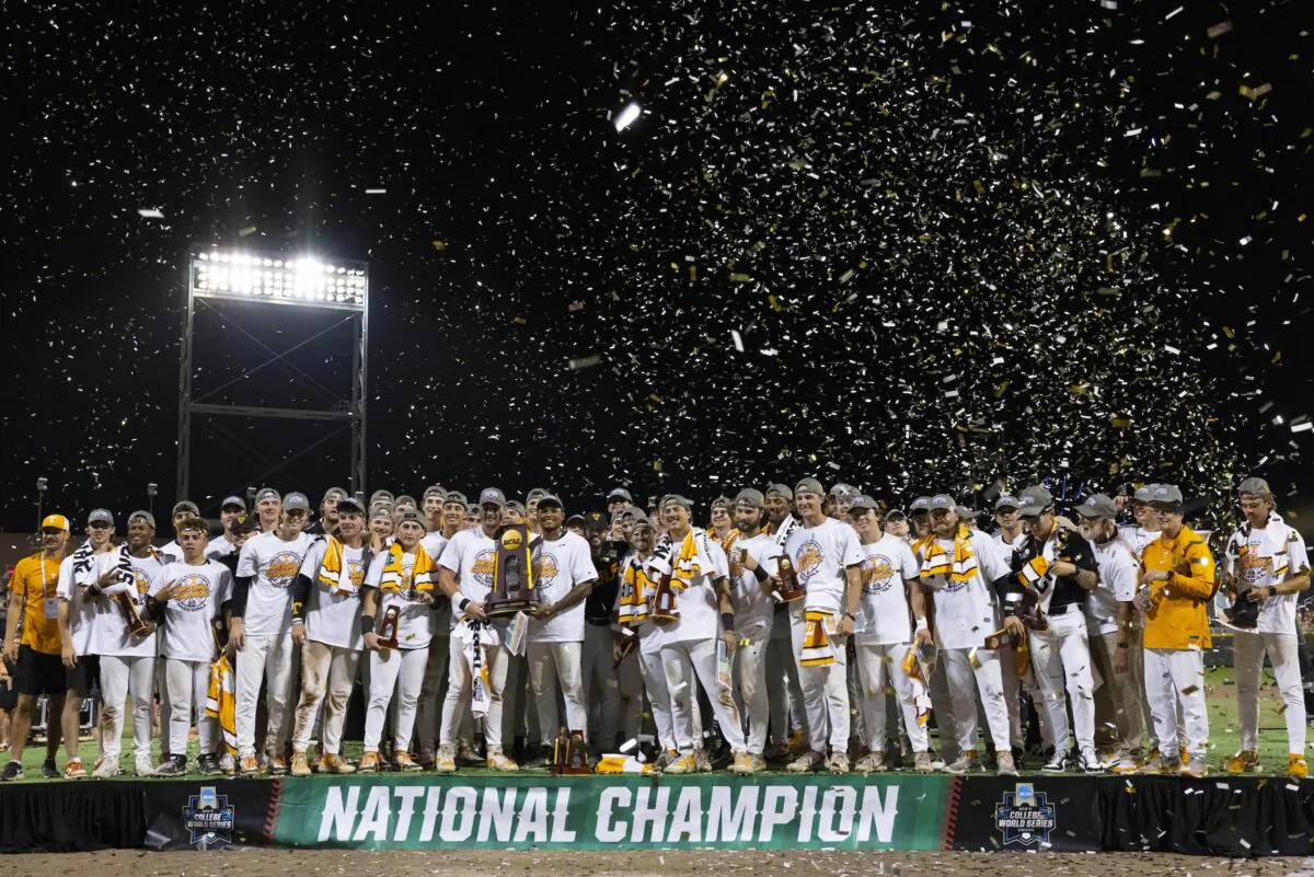 Tennessee is presented with the championship trophy after their victory over Texas A&M in Game 3 of the NCAA College World Series baseball finals in Omaha, Neb., on June 24, 2024. (Rebecca S. Gratz/AP Photo)