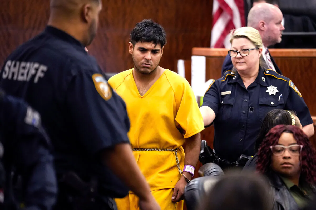 Johan Jose Martinez-Rangel, one of the two men accused of killing 12-year-old Jocelyn Nungaray, is led from the courtroom by deputies in Houston on June 25, 2024. (Brett Coomer/Houston Chronicle via AP)