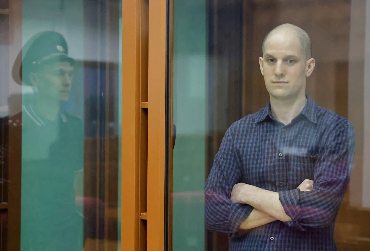 Wall Street Journal reporter Evan Gershkovich is seen inside an enclosure for defendants before a court hearing in Yekaterinburg, Russia, on June 26, 2024. (Evgenia Novozhenina/Reuters)