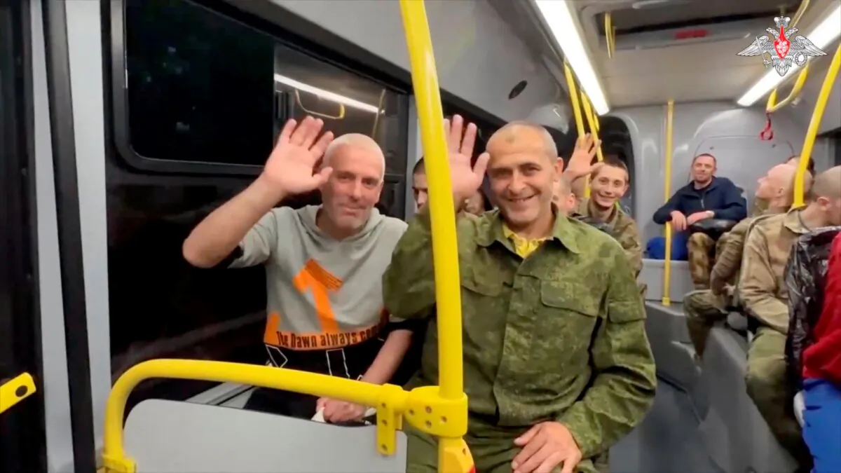 A still image from a video, shows what it said to be captured Russian service personnel react in a bus following the latest exchange of prisoners of war at an unknown location in the course of Russia-Ukraine conflict, in this image taken from footage released on June 25, 2024. (Russian Defense Ministry/Handout via Reuters)