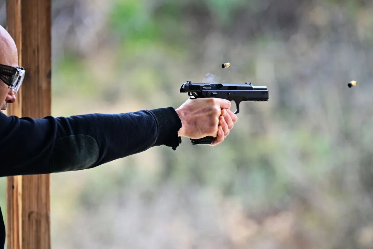 A man fires a pistol during a class at Burro Canyon Shooting Park in Azusa, Calif., on Feb. 12, 2023. (Frederic J. Brown/AFP via Getty Images)