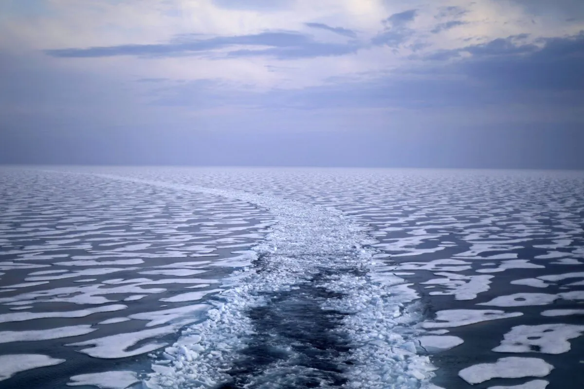 A path in the ice is left in the wake of the Finnish icebreaker MSV Nordica as it traverses the Northwest Passage through the Franklin Strait in the Canadian Arctic Archipelago on July 22, 2017. (The Canadian Press/AP-David Goldman)