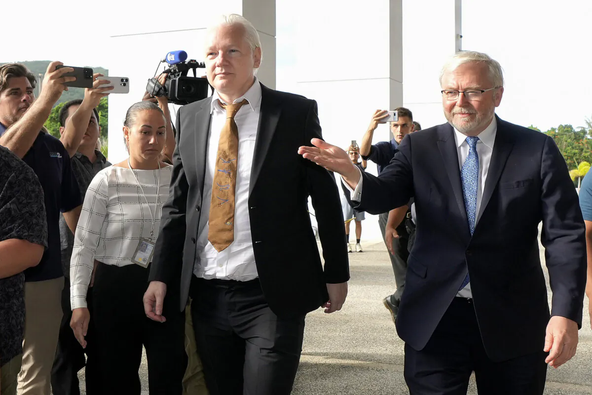 WikiLeaks founder Julian Assange (C) arrives at the United States courthouse where he is expected enter a plea deal in Saipan, Mariana Islands, on June 26, 2024. (Eugene Hoshiko/AP Photo)