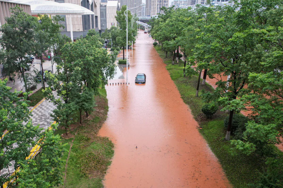 A car is stranded on a flooded street following heavy rains in Changsha in central China's Hunan province on June 24, 2024. (AFP via Getty Images)