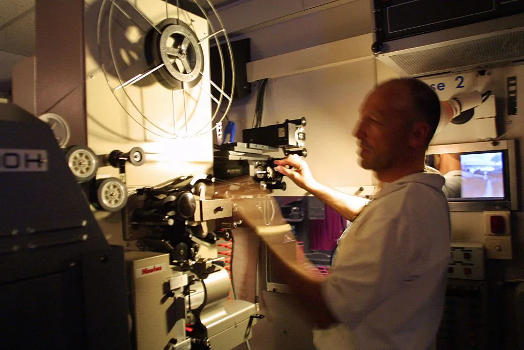 A projectionist at the Palais des Festivals et des Congrès in Cannes, France, on May 14, 2002. (Anne-Christine Poujoulat/AFP via Getty Images)