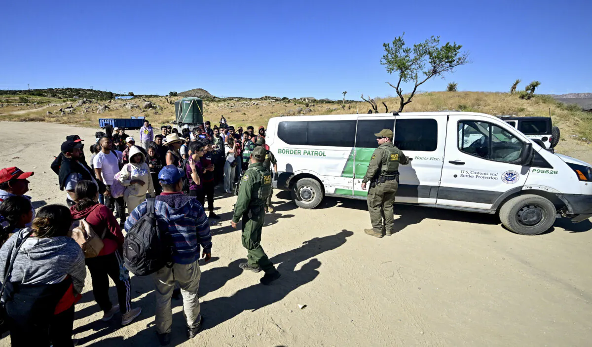 Customs and Border Patrol officers arrive with a vehicle after a group of illegal immigrants walked from Mexico into the United States at Jacumba Hot Springs, Calif., on June 5, 2024. (Frederic J. Brown/AFP via Getty Images)