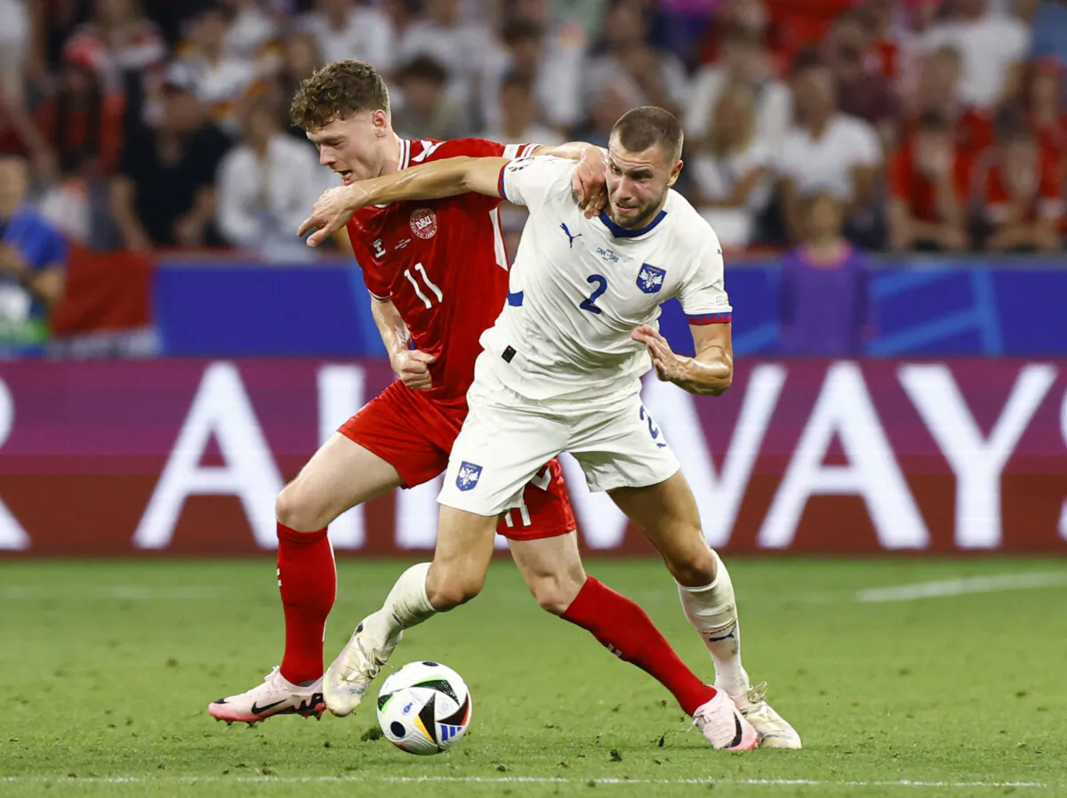 Denmark's Andreas Skov Olsen in action with Serbia's Strahinja Pavlovic on June 25, 2024.（Michaela Stache/Reuter）