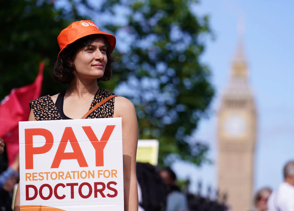 A junior doctor on the picket line outside St. Thomas's Hospital, London, during their continuing dispute over pay, in London on June 27, 2024. (Jordan Pettitt/PA)
