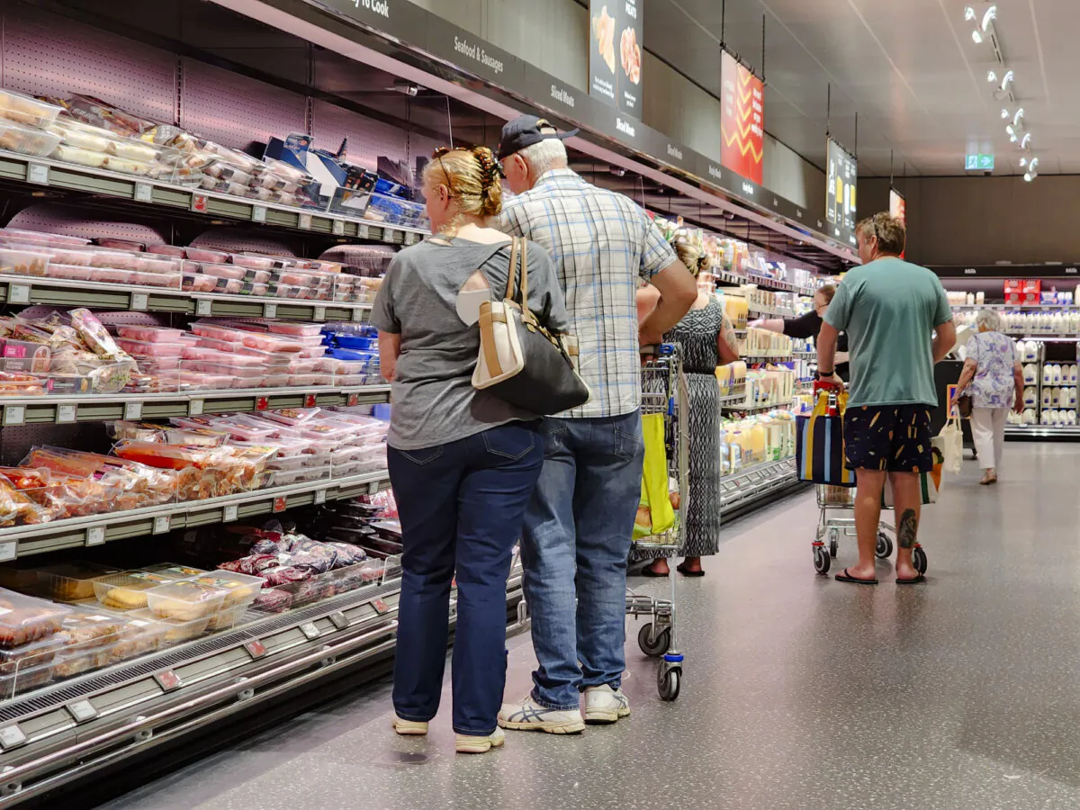 People shop in a supermarket, in this file photo. (Susan Mortimer/The Epoch Times)