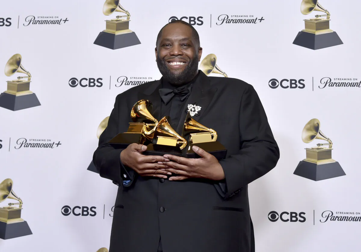 Killer Mike poses in the press room with the awards for best rap performance and best rap song for "Scientists & Engineers," and best rap album for "Michael" during the 66th annual Grammy Awards on Sunday, Feb. 4, 2024, in Los Angeles. (Richard Shotwell/Invision/AP)