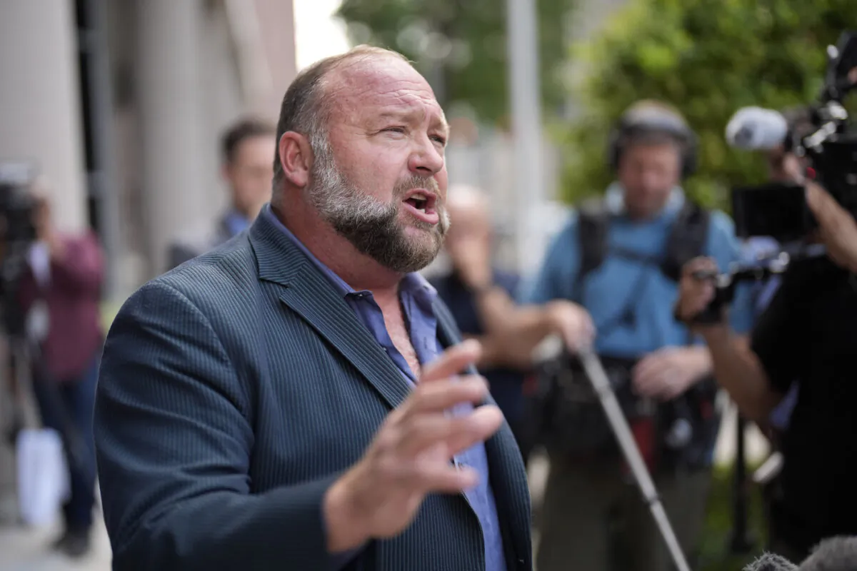 Alex Jones speaks to reporters after arriving at the federal courthouse for a hearing in front of a bankruptcy judge in Houston on June 14, 2024. (David J. Phillip/AP Photo)