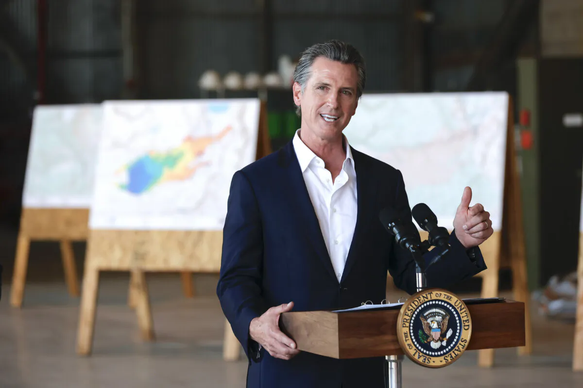 MATHER, CALIFORNIA - SEPTEMBER 13:  California Gov. Gavin Newsom delivers remarks to reporters after a helicopter tour with U.S. President Joe Biden of the Caldor Fire area, at Mather Airport on September 13, 2021 in Mather, California. Biden toured the wildfire-damaged area near Sacramento with Newsom before heading to Los Angeles to participate in a No on Recall campaign event.  (Photo by Justin Sullivan/Getty Images)