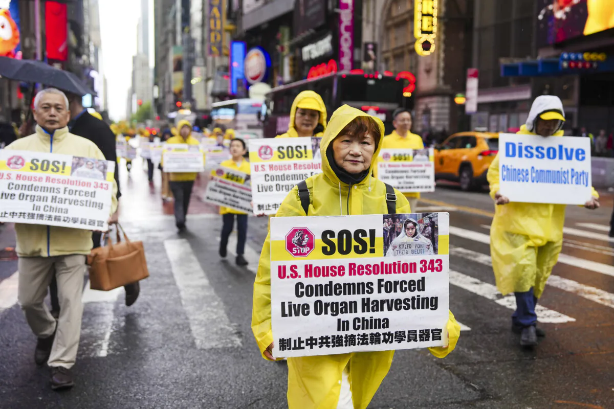 Falun Gong practitioners take part in a parade to celebrate World Falun Dafa Day while calling for an end of the persecution in China, in New York City, on May 10, 2024.(Samira Bouaou/The Epoch Times)