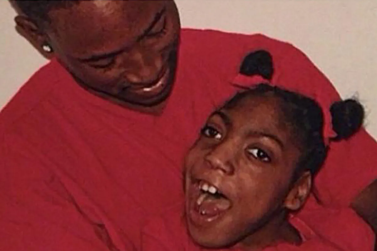 Timesha Beauchamp with her brother Steven Thompson in Southfield, Mich. (Courtesy Erica Lattimore through Fieger Law via AP, File)