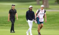 Akshay Bhatia Shares the Lead in Detroit After His Golf Ball Finds a Fairway Drain on the 17th