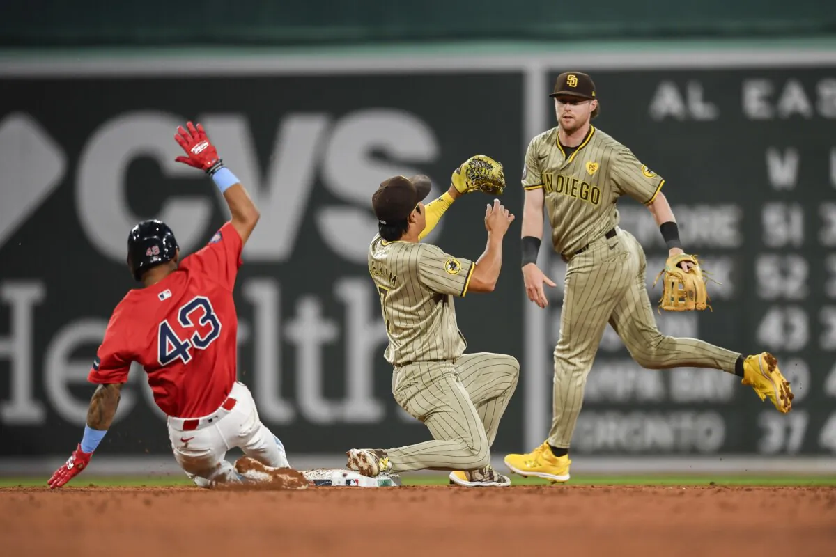 Ceddanne Rafaela (43) of the Boston Red Sox (L) gets out after sliding into second against Ha-Seong Kim (7) and Jake Cronenworth (9) of the San Diego Padres during the fifth inning at Fenway Park in Boston on June 28, 2024. (Jaiden Tripi/Getty Images)