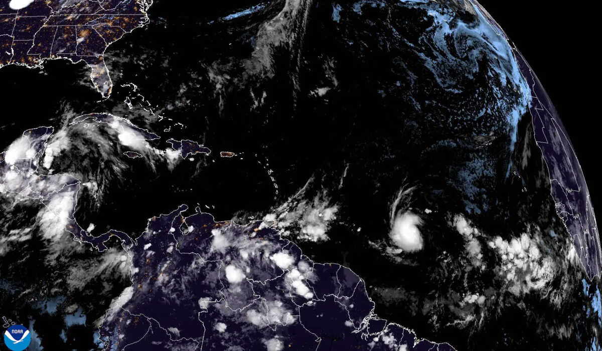 A satellite image shows Tropical storm Beryl (lower center R) as it strengthens over the Atlantic Ocean at 3:10 a.m. GMT on June 29, 2024. (NOAA via AP)