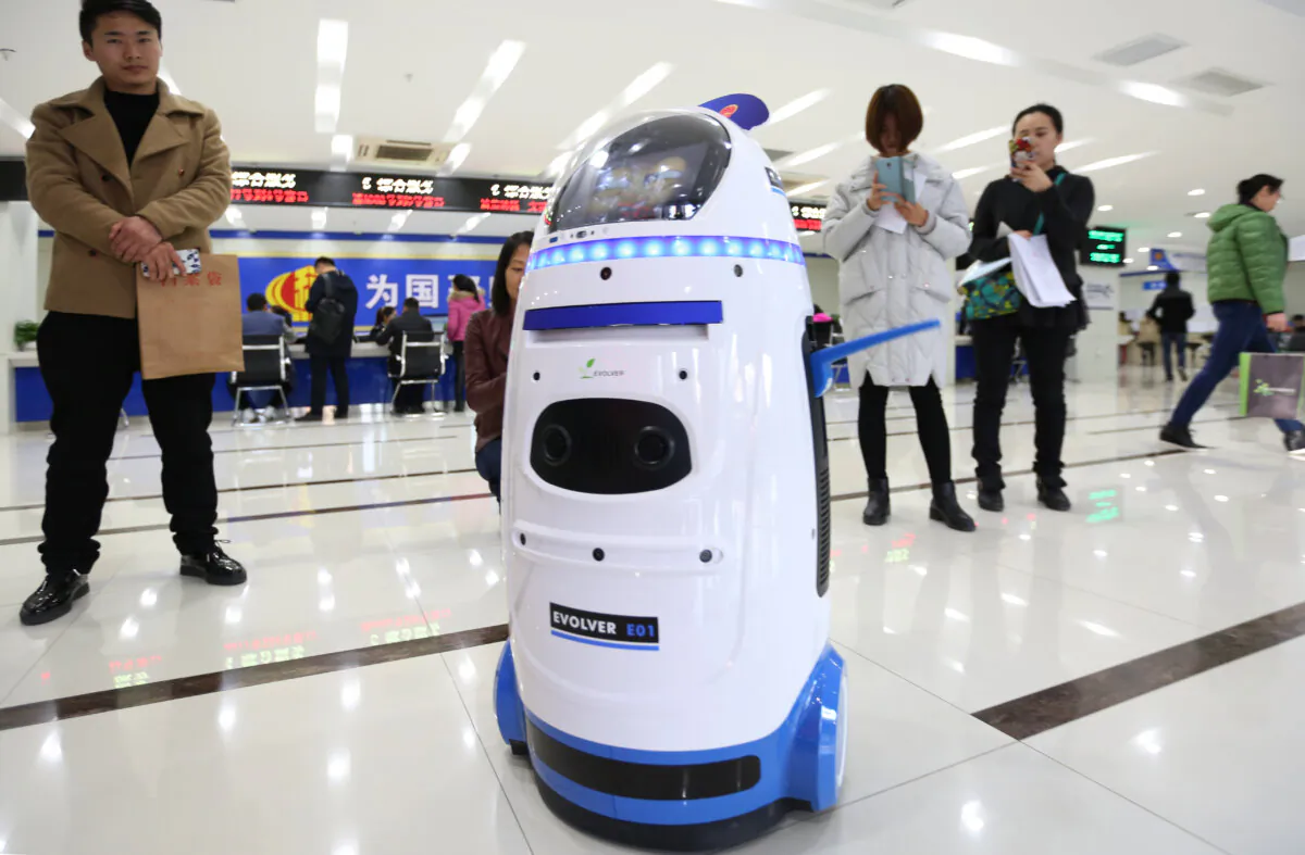 The tax service robot "Shui Xiao Qu" amuses people at the taxation administration of Qujiang New District on December 5, 2016 in Xi'an, Shaanxi Province of China. (VCG/VCG via Getty Images)